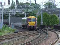 334017 crosses Wallneuk Junction as it pulls away from Paisley Gilmour Street heading for Glasgow Central<br><br>[Graham Morgan 22/05/2007]