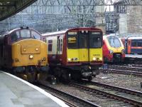 314209 departing Glasgow Central passes 37411 and a Cross Country Voyager and a GNER service all waiting their turn to leave.<br><br>[Graham Morgan 12/05/2007]