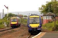 Trains for Stirling and Glasgow Queen Street pass at Larbert North on 28 May. <br><br>[Bill Roberton 28/05/2007]