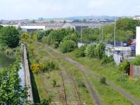 Kirkland East Loop from Bawbee Bridge, a  view of what might be the new site for a Levenmouth area station. The original main line turned to the right at the factory top centre, to Leven station (cl.1969) and the Fife Coast Line. The River Leven can be seen on the left.<br><br>[Brian Forbes 01/06/2007]