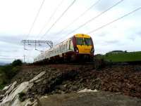 334039 passes with a Helensburgh - Drumgelloch service on 29 May near Ardoch.<br><br>[John McIntyre 29/05/2007]