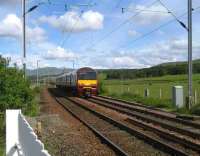 320309 Glasgow bound at Ardmore East LC on 28 May.<br><br>[John McIntyre 28/05/2007]