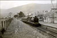 Stirling - Dollar train arriving at Dollar. N.B.R. 0.6.0 64461.<br><br>[G H Robin collection by courtesy of the Mitchell Library, Glasgow 16/06/1951]