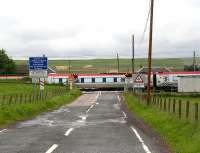 A southbound Virgin Voyager thunders through the former Auchengray station and over the level crossing on 28 June 2007 on a Glasgow Central - Plymouth Cross Country service.<br><br>[John Furnevel 28/06/2007]