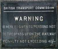 British Transport Commission trespass warning sign. Rectangular metal sign (probably black background with white lettering and border) located at the site of Abercorn Station, Paisley on the Paisley & Renfrew line. Bearing the legend - British Transport Commission - WARNING - Is hereby given to persons not to trespass upon the Railway - Penalty not exceeding 40s.<br><br>[Alistair MacKenzie 15/01/1980]