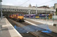 Waverley east end on 5 July with North Berwick and Newcraighall services alongside the marooned 67020 and 90018.  <br><br>[John Furnevel 5/07/2007]