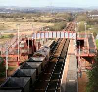 Coal empties rumble west through Baillieston station on 23 April 2007 heading for Clydeport, Hunterston... and more coal.<br><br>[John Furnevel 23/04/2007]