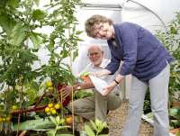 Volunteers Sheena and Bill Stevenson pictured on 4 August in one of the Wemyss Bay Station Garden polytunnels.<br><br>[First ScotRail 04/08/2011]