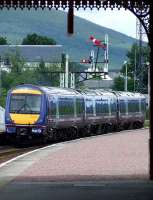 170415 with the 1431 service to Inverness departing Aviemore past the semaphore signals at the north end.<br><br>[Graham Morgan 06/07/2007]