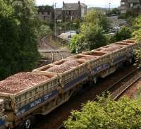 <I>More ballast anyone?</I> ...another load waiting to move up to the works site stretches back over Inverkeithing South Junction while the branch to Rosyth dockyard meanders off down the hill.<br><br>[John Furnevel 24/07/2007]
