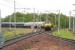 Crossing the up WCML on the approach to Carstairs station at 0835 on 17 May 2007 is EWS 90026 with the empty stock of the Edinburgh portion of the Caledonian Sleeper. The train is heading for Polmadie depot.<br><br>[John Furnevel 17/05/2007]