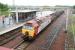 8.30am on a wet Thursday at Carstairs. 57316 <I>Fab1</I> held in the down loop on a freight awaiting a passing movement off the Edinburgh line. The passengers are off the 05.10 Manchester Piccadilly - Glasgow Central awaiting the <I>branch connection</I> to Waverley. [See image 15040]<br><br>[John Furnevel 17/05/2007]