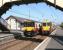 SPT liveried ScotRail services formed by 318252 and 334036 pass at Prestwick Town on 3 May 2007 with north and southbound trains running between Glasgow Central and Ayr.<br><br>[John Furnevel 03/05/2007]