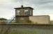 Obscure signalboxes: Heatheryknowe. This was located west of Blairhill at the former Heatheryknowe Junction where lines to Lochwood and Heatheryknowe collieries left the Glasgow to Airdrie line. The box was abolished by the Yoker resignalling scheme. View looks north.<br><br>[Ewan Crawford /12/1989]