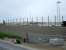 Looking through the fence at the EWS development at Raiths Farm on 21 June with sidings and lighting towers now present.<br><br>[John Williamson 21/06/2007]