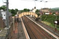 View south west over Glengarnock station towards Dalry on 17 June 2007. Originally opened as Glengarnock and Kilbirnie in 1840, it became plain Glengarnock in 1905. <br><br>[John Furnevel 17/06/2007]