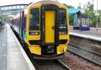 158716 in Scotrail livery due to depart with the 1556 for Edinburgh. The semaphore starting signal is off.<br><br>[Brian Forbes 30/06/2007]