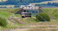 Unidentified class 170 heads north under the busy A9<br><br>[Brian Forbes 28/07/2007]