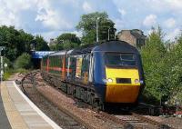 A southbound HST arrives at Kirkcaldy  on 17 July adorned with a sticker advertising cheap tickets south of the border.<br><br>[Brian Forbes 17/07/2007]