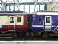 156434 and 15642 at Glasgow Central showing the contrasting colours utilised within First ScotRail train services around Glasgow.<br><br>[Graham Morgan 23/06/2007]