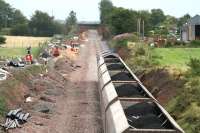 Looking south from Dornock on 3 August showing preparatory work in connection with the redoubling of the line as a coal train heads towards Gretna.<br><br>[John Furnevel 3/08/2007]
