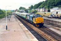 Another day, another ECS 37 hauled train enters Dingwall. The few loco hauled trains north of Inverness at the time resulted in the same train on different days.<br><br>[Ewan Crawford //1989]