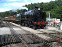 Schools class 30926 <I>Repton</I> brings a rake of LNER coaches south over the level crossing into Levisham on the NYMR on 31 July. <br><br>[John McIntyre 31/07/2007]
