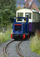 Barclay locomotive with a train on the Almond Valley narrow gauge line, Livingston.<br><br>[Bill Roberton 15/08/2007]
