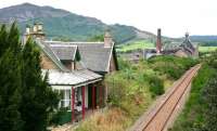 <I>And you couldn't wish for better neighbours... </I> Looking west beyond the old Edderton station in August 2007 towards the Balblair distillery dating from 1790.<br><br>[John Furnevel 30/08/2007]