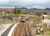 Heading north from Dalwhinnie on 25 August 2007 past the surviving water tank base and operational signal box.<br><br>[John Furnevel 25/08/2007]