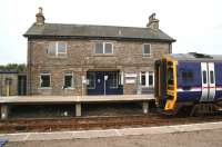 The station building at Georgemas Junction on 28 August 2007, with 158740 standing alongside awaiting its departure time for Inverness.<br><br>[John Furnevel 28/8/2007]