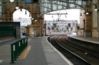 Looking out along platforms 12 and 13 at Glasgow Central on 9 September 2007. The short platform 11a can be seen in the centre background. There are plans to realign this platform and extend it back into the station through the arch on the left to accomodate future <I>Glasgow Airport Rail Link</I> services. Work on the project is due to commence in 2009.<br><br>[John Furnevel 09/09/2007]