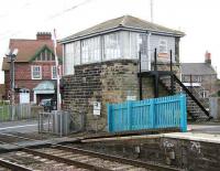 The level crossing and box at Chathill on 16 August 2007. The impressive building in the background with the portico entrance is the village post office. <br><br>[John Furnevel 16/08/2007]