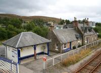 Calm before the storm. Looking over Lairg station from the footbridge on 31 August 2007 with the oil depot at the rear. The station buildings on the up side lie beyond the (staggered) platform.<br><br>[John Furnevel 31/8/2007]