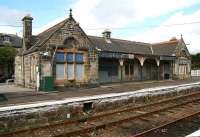 The former station building at Brora with a definite <I>left to rot</I> look about it in August 2007. The circular stone inserts above the windows read <I>HR</I> and <I>1895</I> respectively.  <br><br>[John Furnevel 29/08/2007]