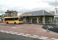Rail passengers arrive at the recently opened Markinch Interchange on 20 September 2007 off a bus from Glenrothes. The old station building and booking office stands in the left background. <br><br>[John Furnevel 20/09/2007]