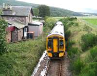A train from the far north passing the long closed station at Meikle Ferry on 25 August 2007. The station was open for less than 5 years, closing on 1 January 1869, having been originally planned when consideration was being given to taking a direct route north from here across the Dornoch Firth.  <br><br>[John Furnevel 25/08/2007]