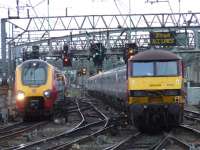221141 <I>Amerigo Vespucci</I> passing by 92016 and the empty Caledonian Sleeper with 90018 at the rear<br><br>[Graham Morgan 01/09/2007]