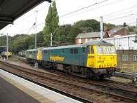 Two Class 86/6 locomotives run into the refuelling sidings at Ipswich in September 2007, with various class 66 examples standing in the background.<br><br>[Michael Gibb 29/09/2007]