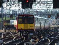314210 leaves Glasgow Central on 10 September with a Neilston service.<br><br>[Graham Morgan 10/09/2007]