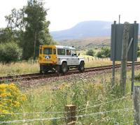 An Aquarius PW Roadrail vehicle approaching Kildonan station on 27 August 2007, having reversed north along the section from Rogart on an inspection trip [see image 20547].<br><br>[John Furnevel 27/08/2007]