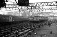 303 and 311 units pass outside Glasgow Central in March 1974 as a 6-car 101 DMU service pulls out of the station.<br><br>[John McIntyre /03/1974]