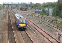View east over Cadder yard on 27 September 2007 with an afternoon Edinburgh - Glasgow Queen Street train approaching.<br><br>[John Furnevel 27/09/2007]