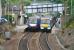 Passing strangers. View east at Polmont on 7 August 2007, with Edinburgh and Glasgow bound stopping trains at the platforms sporting old and new ScotRail liveries.<br><br>[John Furnevel 07/08/2007]