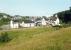 An idylic scene with a fine assembly of station buildings. Helmsdale looking north at the station. Here the line leaves the coast to run northwards inland to Georgemas Junction.<br><br>[Ewan Crawford //1989]