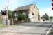 ECML level crossing at Christon Bank, Northumberland on an extremely hot 16 August 2007. The converted goods shed stands on the east side of the crossing, with the former station building off to the left. In the background is the Blink Bonny, which has a spacious and welcoming beer garden... just thought I'd mention that..<br><br>[John Furnevel 16/08/2007]