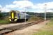 A Kyle of Lochalsh - Inverness train approaching Dingwall Junction in 2005. In the foreground is Dingwall Canal North level crossing.<br><br>[Ewan Crawford //2005]