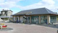 New interchange building, with bus stop and turning circle at Markinch. The old station buildings stand in the backgroud.<br><br>[Brian Forbes /08/2007]