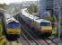60029 brings the empty <I>Binliner</I> out of the landfill sidings at Oxwellmains on 19 September as a GNER Kings Cross - Edinburgh service passes on the ECML. <br><br>[Bill Roberton 19/9/2007]