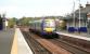 An Aberdeen - Edinburgh train runs through Ladybank on 20 September while a freight is held at signals waiting to come off the Perth line in the left backgound.<br><br>[John Furnevel 20/09/2007]